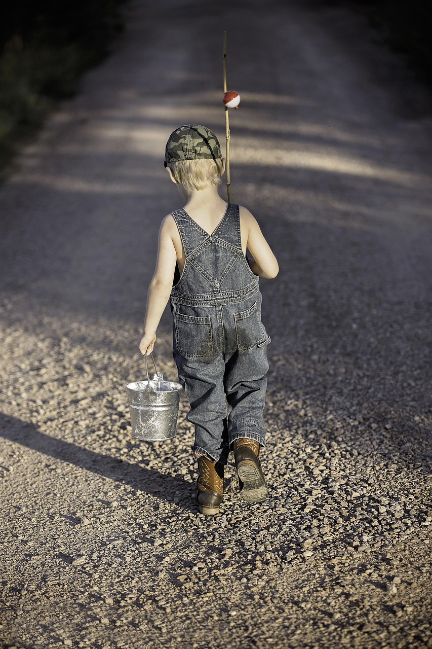 about-us-01 boy, child, fishing rod, bucket, fishing, fisherman, kid, young, small, nature, childhood, walking, summer, adventure, lifestyle, outdoors, back view